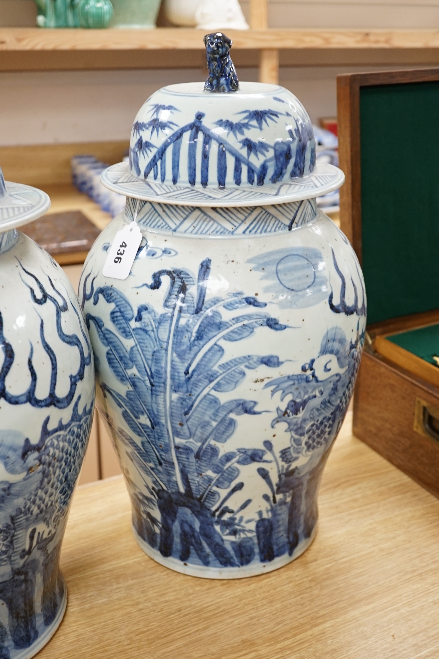 A pair of large Chinese blue and white ginger jars and covers, 54cm high. Condition - fair to , good